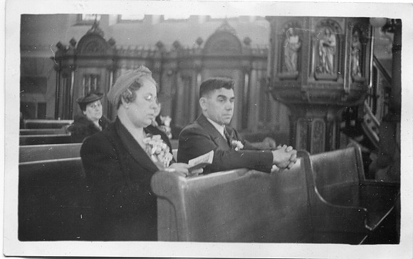 Grooms parents in church